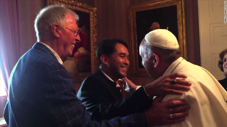 151003075258-pope-francis-meets-hugs-same-sex-couple-00000803-exlarge-169